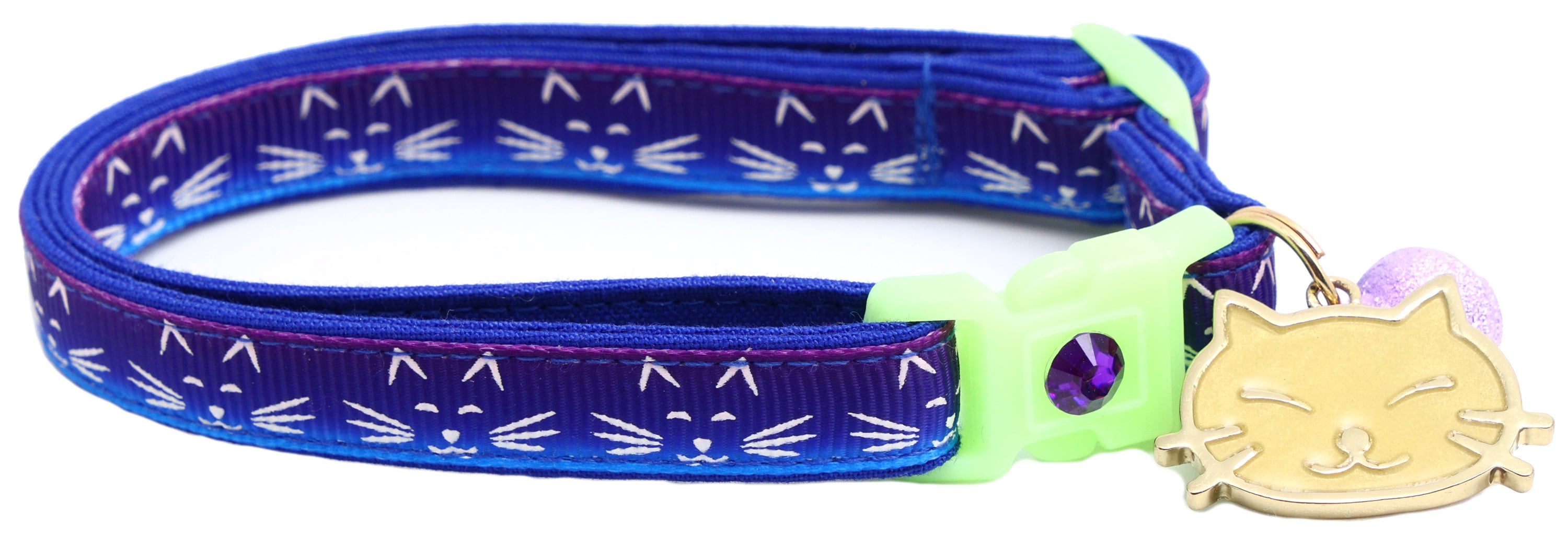 A glowing cat faces breakaway collar made of reinforced cotton, featuring a bell and charm, perfect for nighttime visibility.